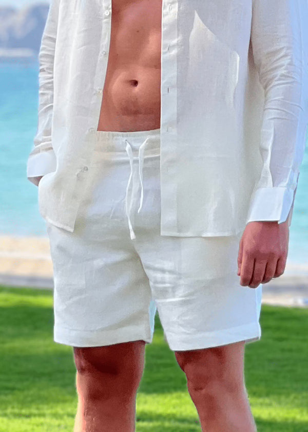 Natural swim shorts in Oyster colour made of 100% Belgian linen fabric detailed with walnut button, from Pieter Petros — the first 100% natural swim shorts in the world