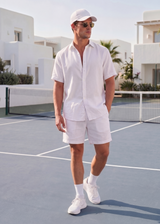 men in linen natural clothing on tennis court