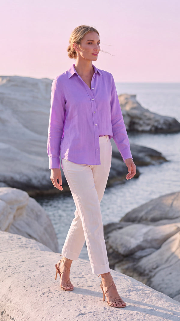 PP Linen Blouse in Orchid Belgian linen, front view with seashell buttons, worn on the white rocks of Milos at dusk.