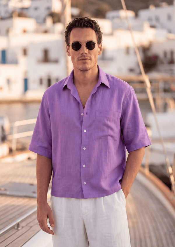 Violet Pieter Petros linen shirt in 100% Belgian linen with seashell buttons, handmade in Dubai, worn on a Greek sailboat